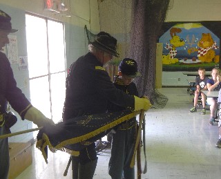 Alex affixes banner on guidon